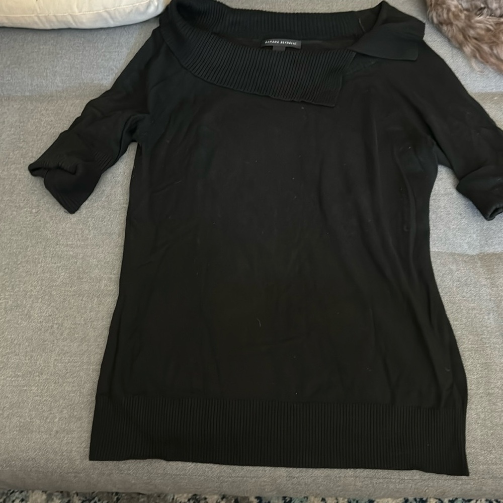 Simple black sweater, with a fold over neck, and longer short sleeves